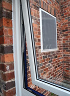 Close up of open aluminium casement window