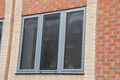 Aluminium drop back window with integral security mesh